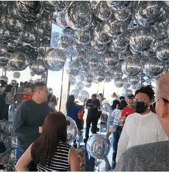 Floating mirrored sphere room