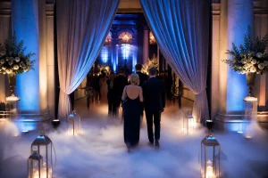 Elegant gala entrance enhanced with low-lying fog and cinematic blue lighting
